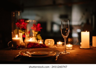 Candlelight date in restaurant. Champagne glasses, bouquet flowers. Romantic dinner setup at night. Table setting for couple, Valentine's Day evening, burning candles for surprise marriage proposal. - Powered by Shutterstock