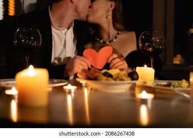 Candlelight Date For Valentines Day, Couple In Love Kissing At Dinner, Close-up, Candles And Wine On Festive Table For Two, Concept Of Valentine's Day Celebration At Home