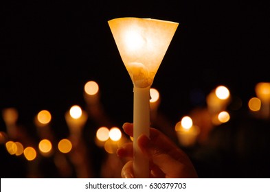 Candlelight Vigil With Shallow Depth Of Field Creating Round Bokeh