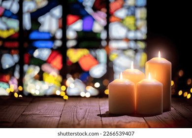 Candles burning in a church background - Powered by Shutterstock