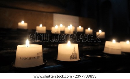 Candles burning in Kecskemét church, Hungary.