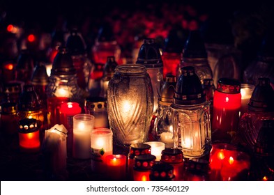 Candles Burning In Lanterns At Night During All Saints Day 