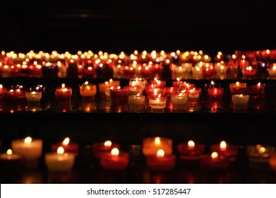 Candles in church. Selective focus. Bokeh.