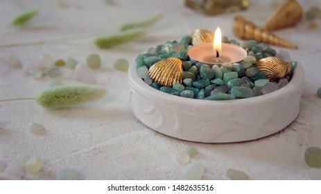 Candles Decorated With Gilded Shells And Green Pebbles. Sea Style.