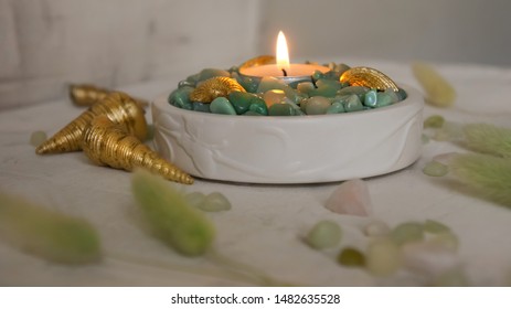 Candles Decorated With Gilded Shells And Green Pebbles. Sea Style.