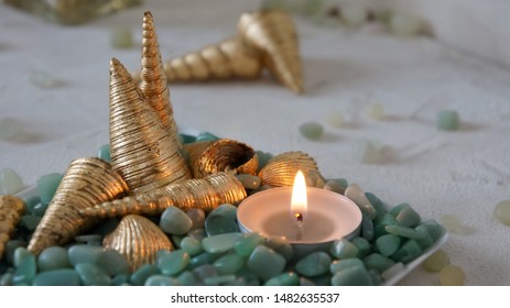 Candles Decorated With Gilded Shells And Green Pebbles. Sea Style.