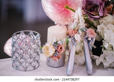 The Candles Decorated Of White Pink Flowers On Wedding Table. Close Up. Wedding Decor For Party.