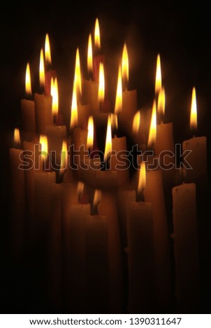 Similar – Many lighted candles in a church