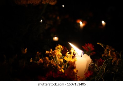 Candles and Flowers at Night in Cemeteries in Mexico For Day of the Dead Holiday