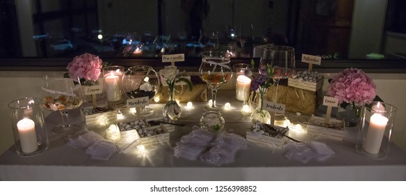Candles in glass lanterns, stylish wedding decor for evening wedding ceremony in garden, light close up. beautiful romantic place for love celebration
