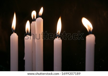 Similar – Many lighted candles in a church