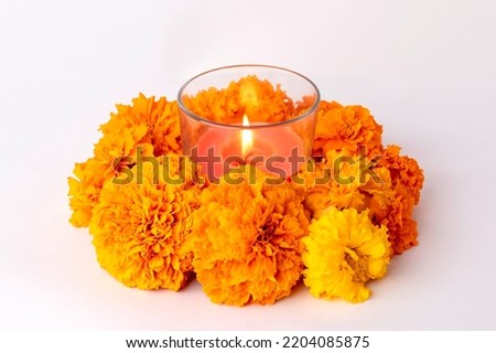 Candles and marigold flowers. Day of the dead concept dia de los muertos.Decoration of the altar.copy space,on a white background