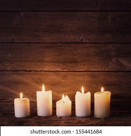 candles on old wooden background - Powered by Shutterstock