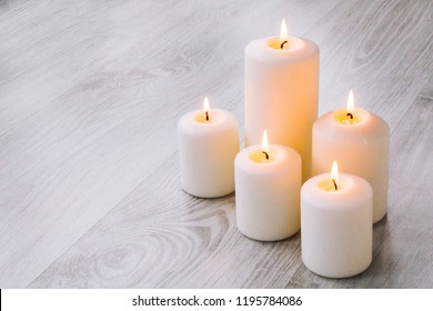 Candles for Spa with stones for a Spa - Shutterstock ID 1195784086