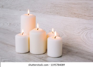 Candles for Spa with stones for a Spa - Shutterstock ID 1195784089