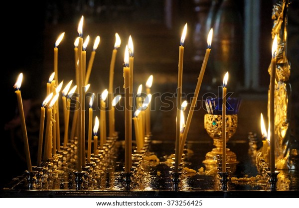 Candles in a\
stand in Russian orthodox\
cathedral.