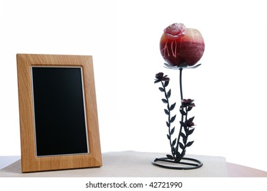 Candlestick And Photoframe On The Table In White Background