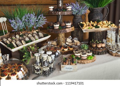 Candy Bar For Birthday Party Or Wedding Against Wooden Background