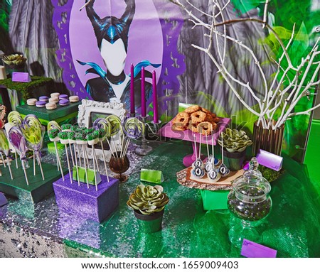 Candy bar decorated in concept of dark mysterious character woman with horns fairy tale