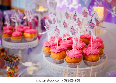 Candy Bar For Kids Birthday Party.Sweet Holiday Buffet With Cupcakes And Marshmallows And Other Desserts.