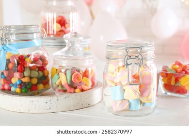 Candy bar. Many different sweets on white wooden table indoors