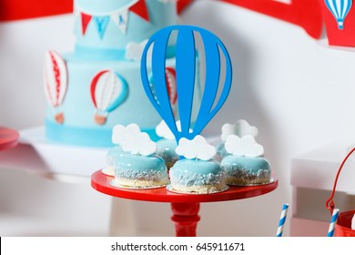 Candy Bar On Boy's Birthday Party With A Lot Of Different Candies, Popcorn, Beverages And Big Cake. Decorated In Blue,red And White Colors, Balloons Or Aviation Theme, Indoor