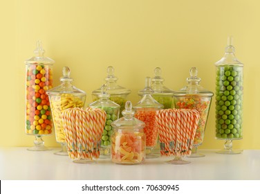 Candy In Bowls On Yellow Background
