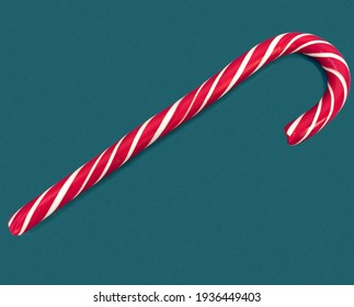 candy cane isolated on blue background, candy cane close up