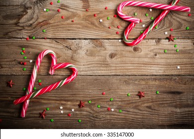 candy canes as heart on  wooden board - Powered by Shutterstock