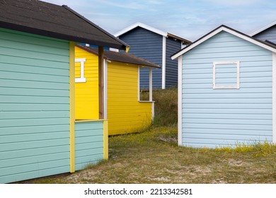 Candy Coloured Beach Huts In The Sand Dunes. Sweden, Skanör, 1 July 2022