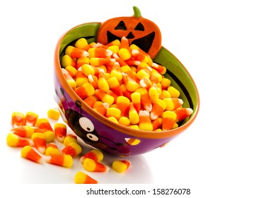 Candy Corn Cadnies In Halloween Bowl On A White Background.