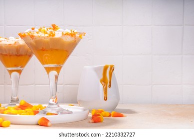 Candy Corn Martini Drink. Sweet And Salty Pumpkin Caramel Cocktail, With Candy Corn Sweets, Copy Space