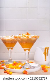 Candy Corn Martini Drink. Sweet And Salty Pumpkin Caramel Cocktail, With Candy Corn Sweets, Copy Space