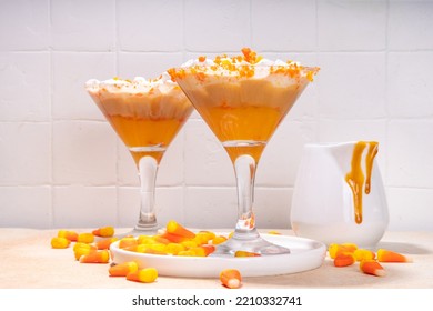 Candy Corn Martini Drink. Sweet And Salty Pumpkin Caramel Cocktail, With Candy Corn Sweets, Copy Space