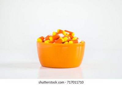 Candy Corn In An Orange Bowl Isolated On White