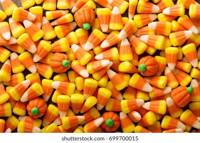 Candy Corn And Pumpkin Halloween Background Overhead Shot