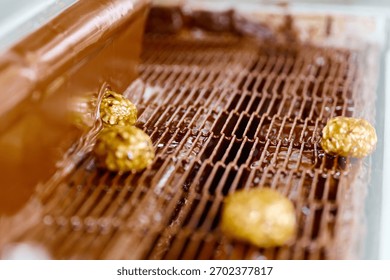 Candy enrobing process using curtain coating technique in a confectionery production facility