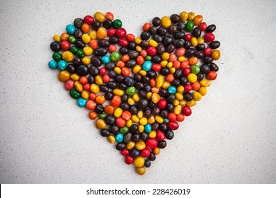 candy heart multicolored pebbles stone sweet chocolate raisins glaze 