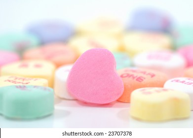 Candy Hearts With Shallow Depth Of Field. One Blank Candy Heart In Focus And Ready For Custom Message Or Logo.