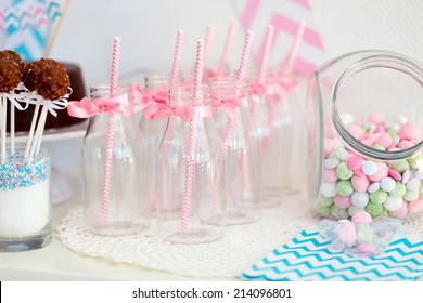 Candy Jar And Fancy Milk Bottles For Drinks On A Dessert Table At Party Or Wedding Celebration