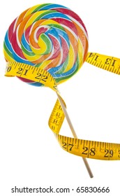 Candy Lolly Pop And Measuring Tape Diet Concept Isolated On White With A Clipping Path.