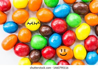 Candy lying on white background. Bright and Colorful sweets top view. Flat lay image. Copy space template. Unhealthy eating concept