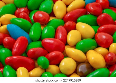 Candy in multi colored glaze in bulk, close-up macro, mini pieces, wallpaper background, full depth of field - Shutterstock ID 2249915289