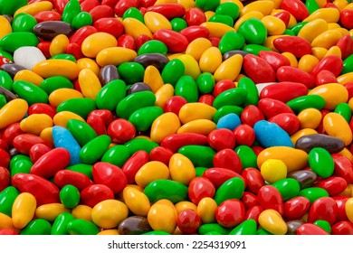 Candy in multi colored glaze in bulk, mini pieces, uniform texture pattern, wallpaper background, full depth of field - Shutterstock ID 2254319091