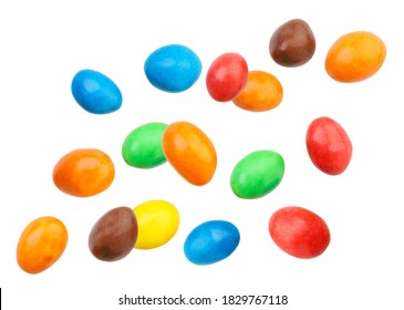 Candy peanuts covered with chocolate in a multicolored glaze fly on a white background. Isolated