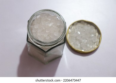 Candy Rock Sugar In Glass Jar Isolated On White Background