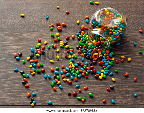 Download Candy Scattered On Floor Glass Jar Stock Photo Edit Now 392709886 Yellowimages Mockups