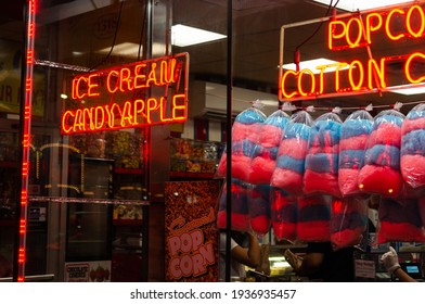 Candy Store Front Night Window Display Of Colorful Cotton Candy Sugary Treats