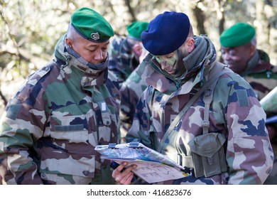 Canjuers, FRANCE - March 13. 2012.Noncommissioned Officers Discuss The Plan Of Training Maneuvers.