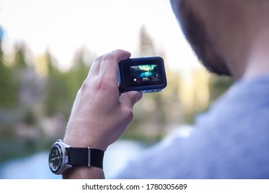 Canmore, AB, Canada - 19 July 2020: A Man Holding GoPro Camera. 